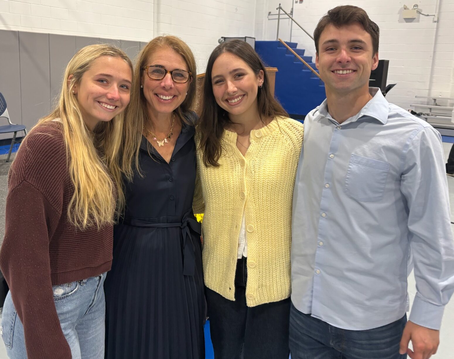 Portrait of Erica Salmon, head of school of Friends School Mullica Hill, with her three children.